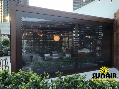 Retracted pergola awning over restaurant